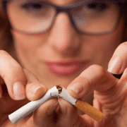 woman breaking cigarette stoping smoking