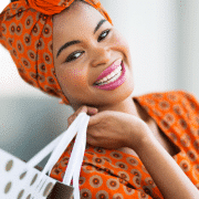 happy black woman shopping to boost her mood