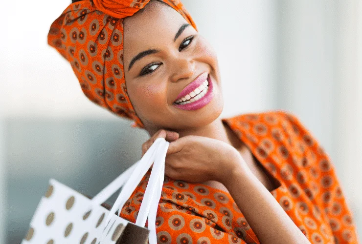 happy black woman shopping to boost her mood