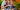 young female travel nurse RN wheels senior patient in assisted living facility
