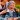 young female travel nurse RN wheels senior patient in assisted living facility