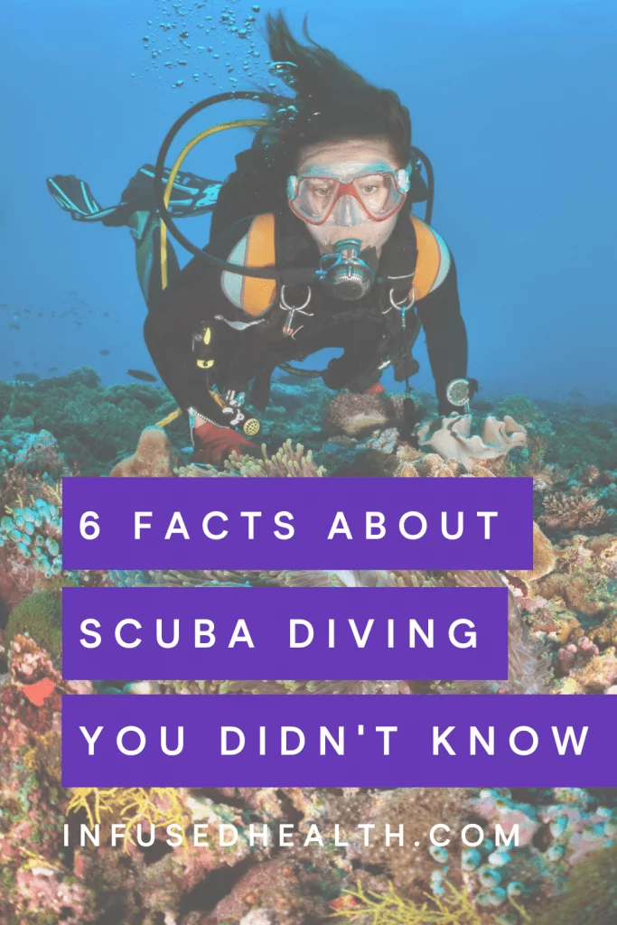 woman scuba diver in coral reef ocean