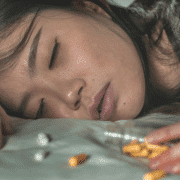 young asian woman overdosing on addictive pills and heroin