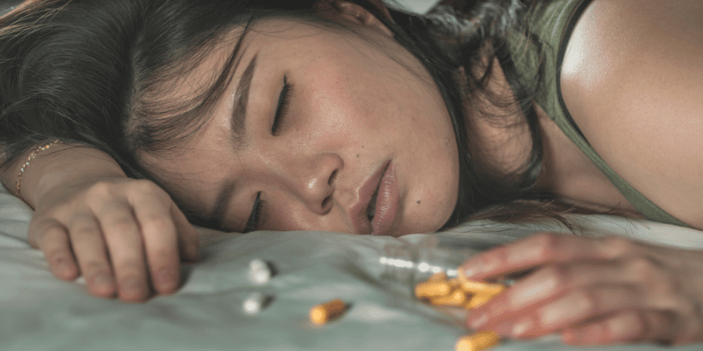 young asian woman overdosing on addictive pills and heroin