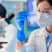 young asian scientist studying c-protein blood test