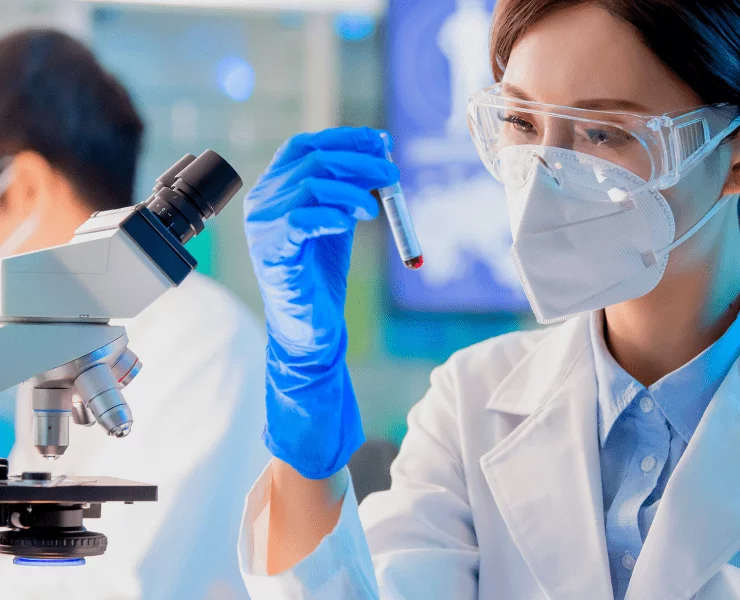 young asian scientist studying c-protein blood test