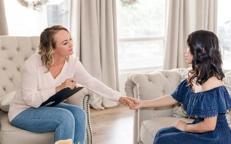 woman therapist helping depressed asian patient