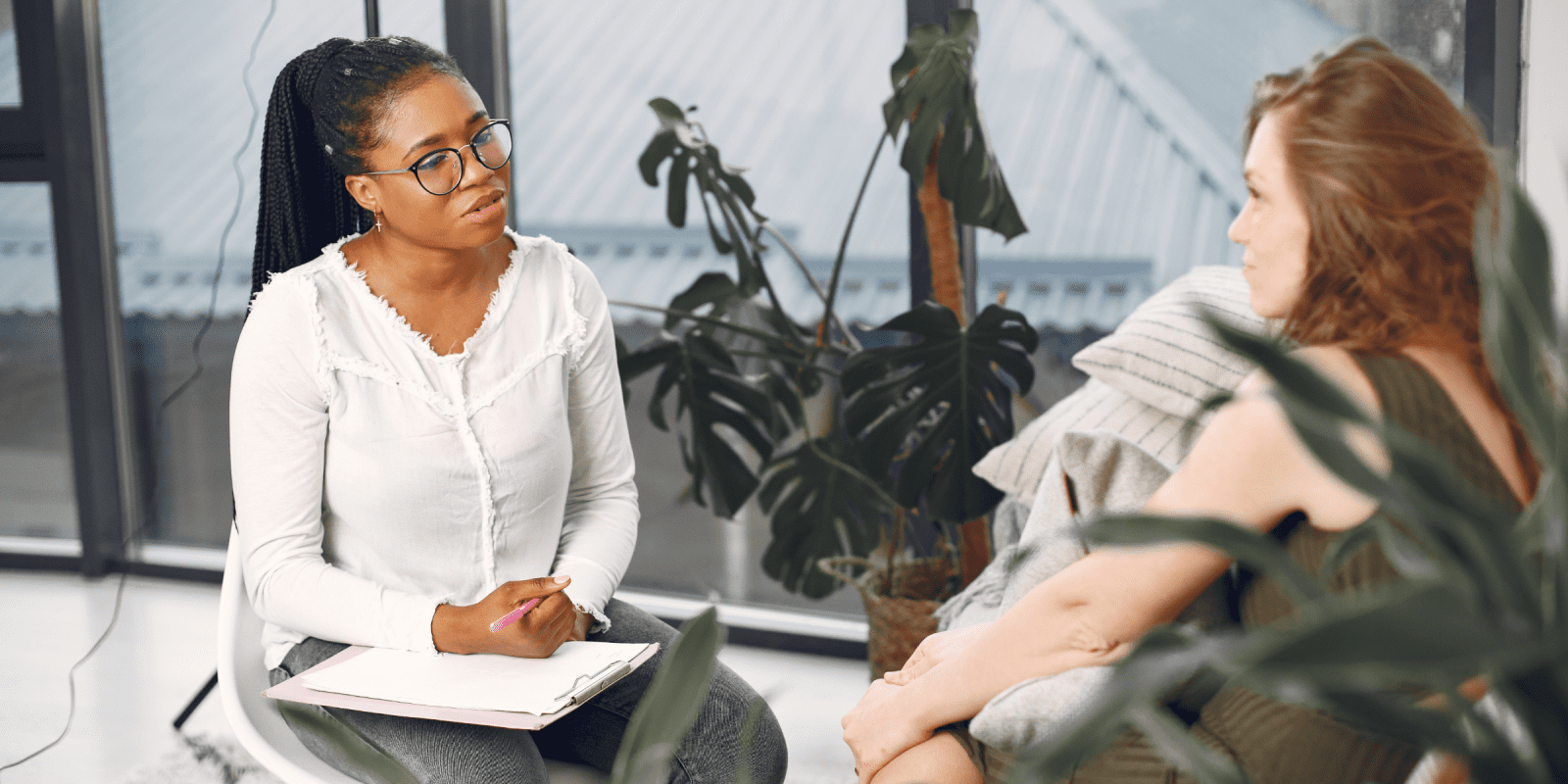 black female therapist doing CBT therapy with depressed patient