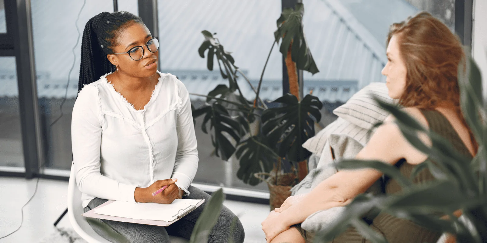 black female therapist doing CBT therapy with depressed patient