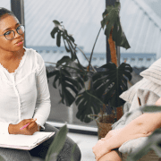 black female therapist doing CBT therapy with depressed patient