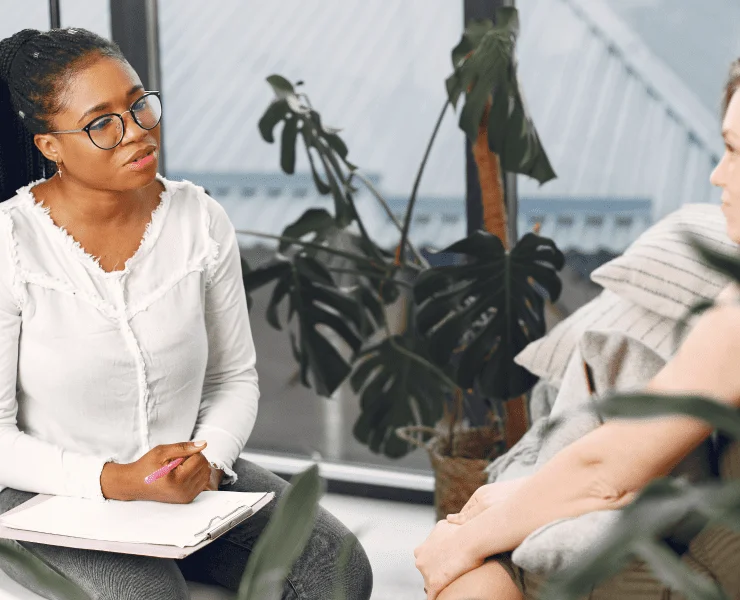 black female therapist doing CBT therapy with depressed patient