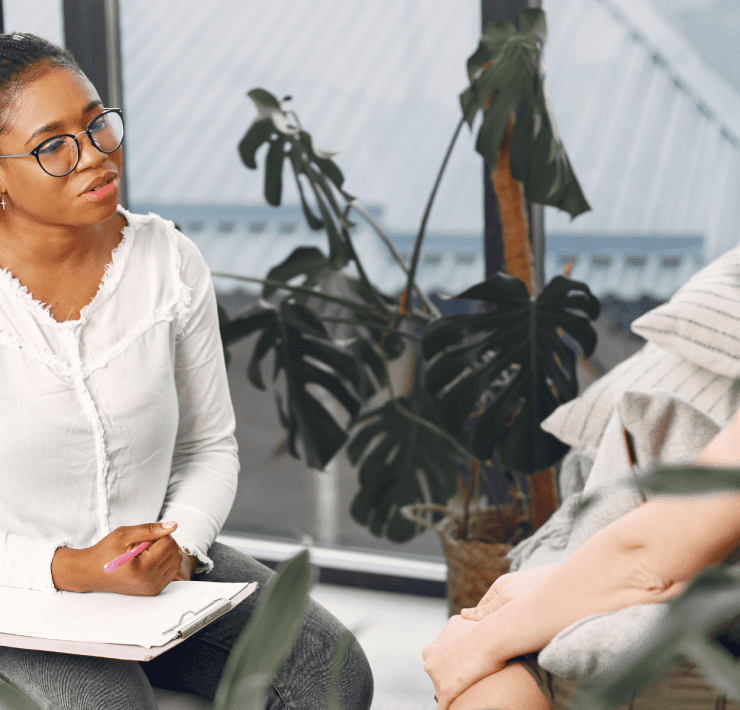 black female therapist doing CBT therapy with depressed patient